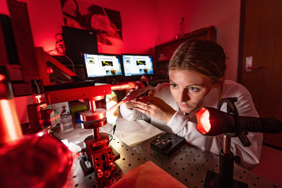 Graduate student Elizabeth Cummins uses an acoustic tweezing device in Professor Damir Khismatullin’s lab as part of a grant to develop technology for the assessment of severe cases of infectious diseases.